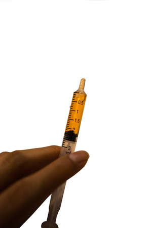 Medicine in the syringe for feeding an infantの写真素材