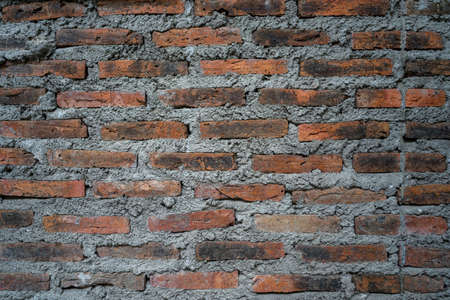 Rustic bricks and cement texture wall for background useの写真素材