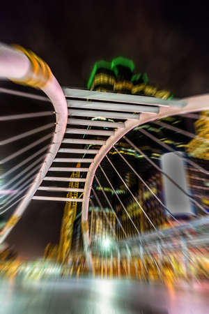The architectural design of the skywalk above the intersection on Sathorn road in bustling Bangkok, Thailandの写真素材