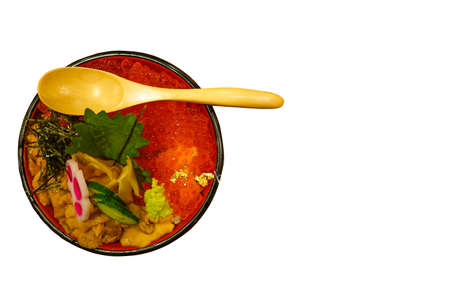 Japanese Food: Sea urchin and salmon roe topped on the rice bowl (Uni and Ikura Don)の写真素材