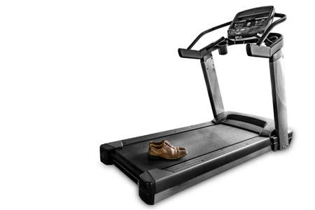 Ironic concept: Leather shoes on an isolated treadmill. Dramatic and color accent effectの写真素材