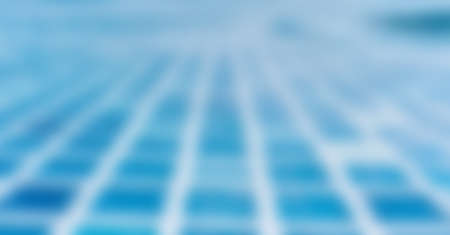 Abstract blurred image of the swimming pool with mosaic floor tilesの写真素材