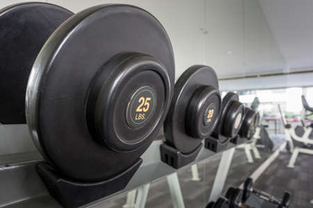 25lbs dumbbell on a rack in the fitness room, shallow DOFの写真素材