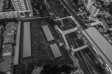 Aerial shot of an empty parking lot next to the sky train mass transit station in the city of Bangkok, Thailandの写真素材