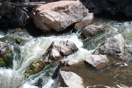 Mountain Stream Runs Over Rocksの写真素材