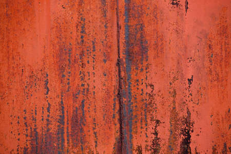 This colorful abstract horizontal photograph shows a rusted section of an old truck.
