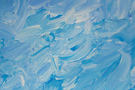 This impasto high-relief abstract expressionist painting in shades of blue and white has powerful, emotive brushstrokesの写真素材