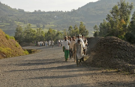 Debark, Northern Ethiopia - September 29, 2012: people in national clothees are going to the market on the road to Debark, a town in Northern Ethiopia. Debark is located near the Simien mountain, at an elevation of 2850 meters above sea. Siemien mountain.のeditorial素材