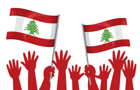 Hands raised holding Lebanese flags in unityのイラスト素材