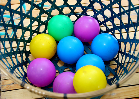 Color plastic balls in basket