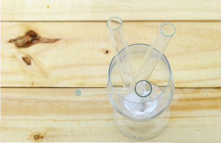 Laboratory glassware for liquids on wood backgroundの写真素材
