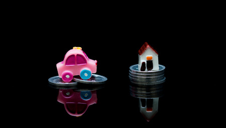 Miniature car and home model with stack coins,Loan Finance Concepts,Insurance and Real Estate Investment Concept.の写真素材