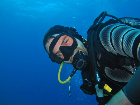 Happy scuba diver underwater portrait.の写真素材