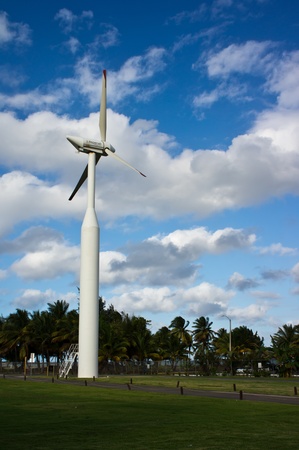Beautiful green meadow with Wind turbines generating electricity 