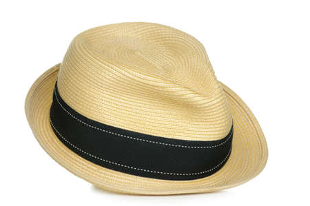 A tan straw fedora hat with a black stripe.の写真素材