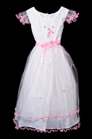 White and pink flower girl wedding dress on black background .の写真素材