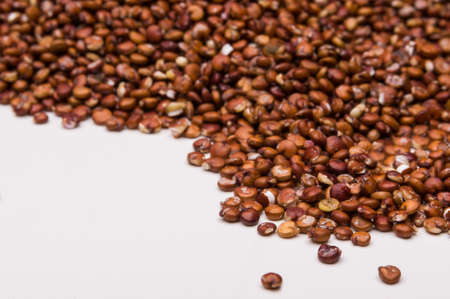 Close up macro shot of organic red quinoa on white の写真素材