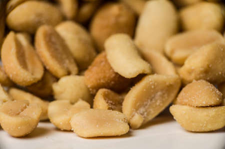 Close up shot of yellow peanuts in a pile.の写真素材