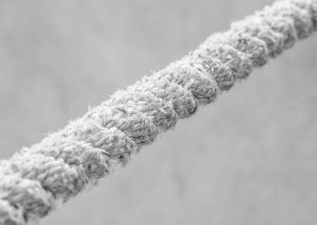 Macro shot of long rugged rope on greyの写真素材