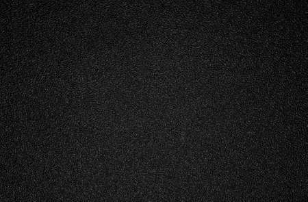 Background shot of black plastic textureの写真素材
