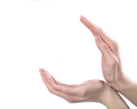 Gesturing. Close-up of human hand gesturing while isolated on white