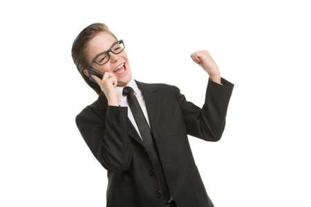 Little businessman on the phone. Happy little boy in formalwear talking on the phone and smiling while isolated on whiteの写真素材