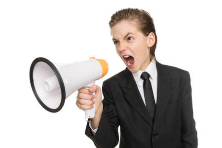 Little businessman with megaphone. Furious little boy in formalwear shouting at megaphone while standing isolated on whiteの写真素材