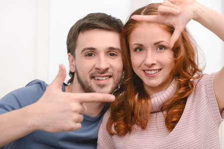 Attractive young couple gesturing