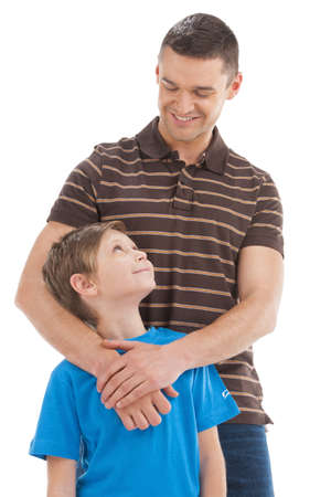 Father and son. Cheerful father and son standing close to each other while isolated on whiteの写真素材