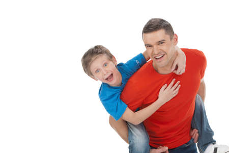 Having fun together. Cheerful father and son having fun together while isolated on whiteの写真素材