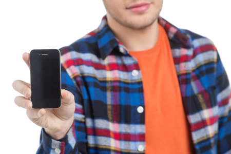 Men with mobile phone. Cropped image of cheerful young men holding the mobile phone while standing isolated on whiteの写真素材