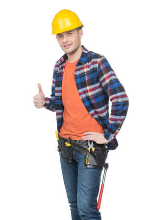 Handyman. Confident young handymen in hardhat holding thumb up while standing isolated on whiteの写真素材