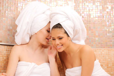 Two young girls gossiping in Turkish saunaの写真素材