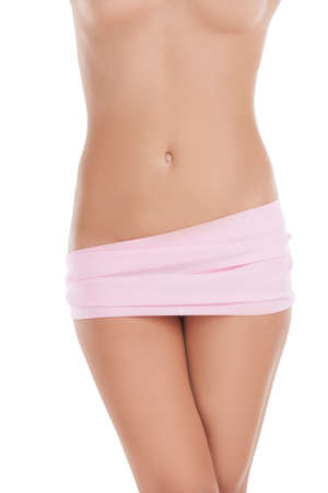 Naked beauty. Cropped image of young naked women covered with pink cloth standing isolated on whiteの写真素材