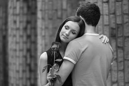 Happy loving couple. Black and white image of young loving couple huggingの写真素材
