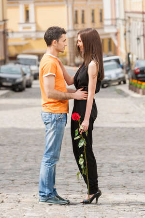 Loving couple. Full length of beautiful young loving couple hugging and looking at each otherの写真素材