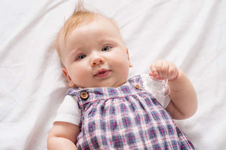 Little baby. Top view of cute little baby looking at cameraの写真素材