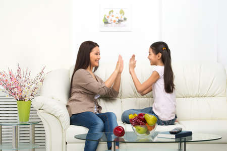 Mother and daughter at home. Mother and daughter having fun at home togetherの写真素材