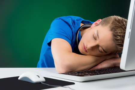 Boy sleeping. Teenage boy sleeping at the computerの写真素材