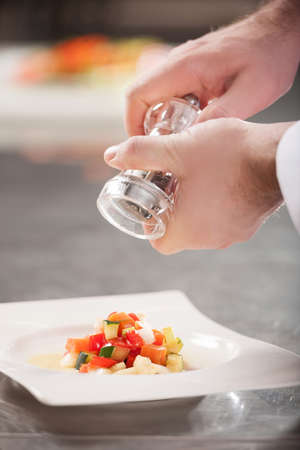 Cooking  Close-up of chef preparing an order