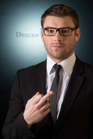 Whoï¿½ boss hear  Bossy young men gesturing on cameraの写真素材