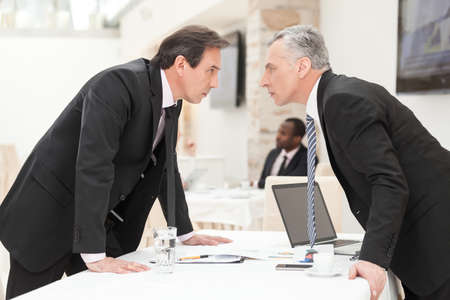 Two businessmen are trying to come to an agreement.の写真素材