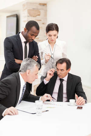 Business meeting - businessman presenting his ideas to colleaguesの写真素材