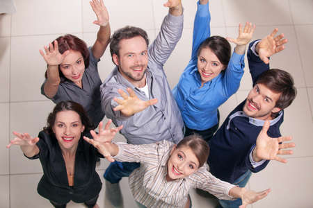 Top view of group of people. Standing together, raising their hands upの写真素材