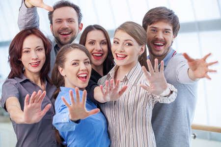 Group of people showing their palm. Women and men standing togetherの写真素材