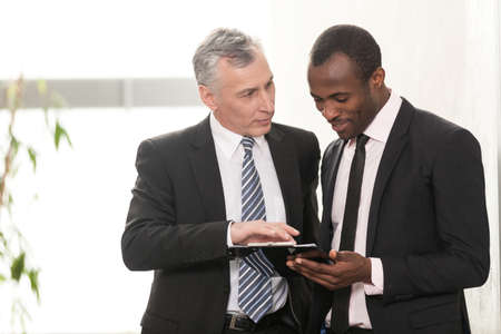 Mature businessman talking in Board Roomの写真素材