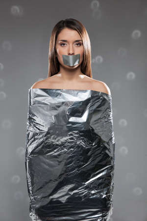 Woman in foil  Beautiful young woman covered with foil