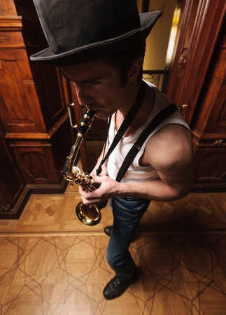 Jazz is the life. Top view of men playing saxophoneの写真素材