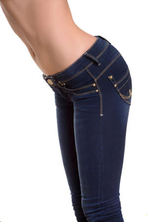 Woman in jeans. Close-up side view of woman in jeans isolated on whiteの写真素材