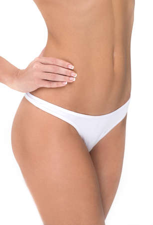 Body of beautiful fit woman. Close up, isolated on whiteの写真素材